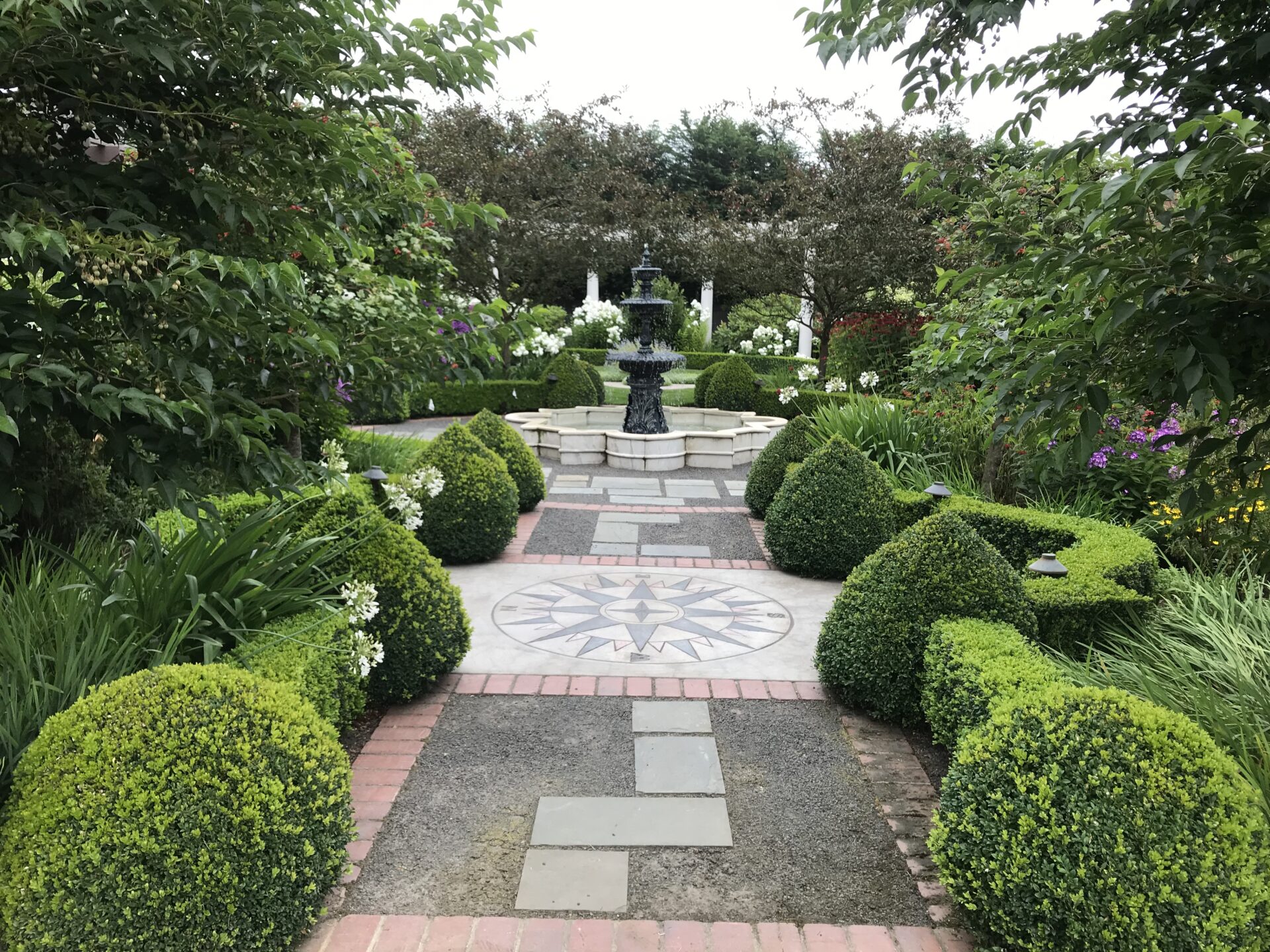 A mature neo-classical parterre at an estate garden